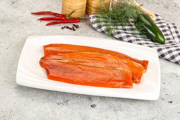Red pickled herring fish fillet