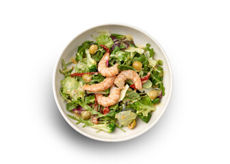 A fresh and vibrant salad topped with grilled shrimp, cherry tomatoes, and a drizzle of balsamic vinaigrette