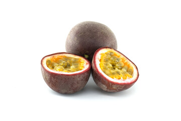 Fresh passion fruits showing juicy interior on white background