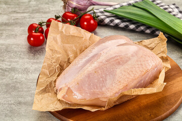 Raw chicken breast with bone