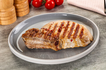 Grilled pork loin steak with bone