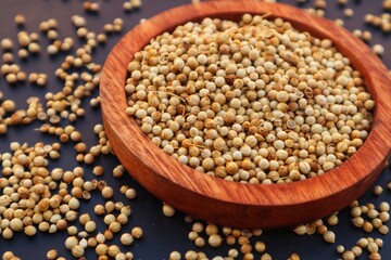Forms of Coriander Seeds (Coriandrum sativum) and ground coriander with close view.