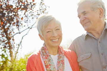 Happy, love and relax with old couple in park for retirement, romance and bonding. Support, marriage milestone and spring with senior man and woman walking in nature for wellness, care and date