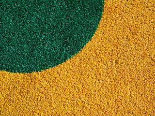 Vibrant green and gold artificial turf creating a dynamic pattern