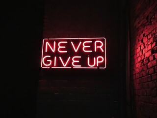  a vibrant neon message of resilience illuminating a dark space