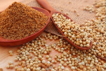 Forms of Coriander Seeds (Coriandrum sativum) and ground coriander with close view.