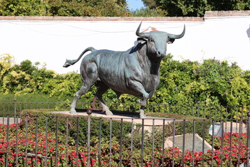 Bull sculpture in front of Bullring Plaza de Toros in the city of Ronda, Andalusia, Spain  
