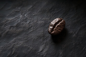 Naklejka premium Bold and Rich A Coffee Bean Highlighted by Dramatic Lighting on a Dark Surface.