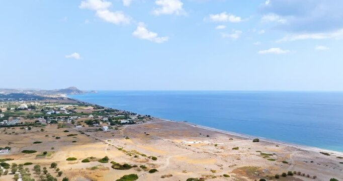 Aerial ascending shot overlooking the east coast of Rhodes, Greece, sunny day