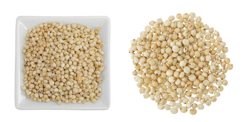 Sorghum seeds in ceramic bowl isolated on white background. Top view. Flat lay.