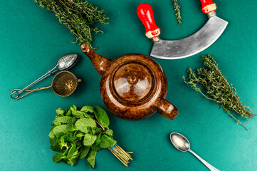 Teapot with fresh herbal tea, tea time.