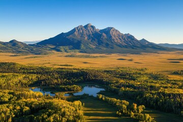 Naklejka premium Breathtaking sunrise view of Mount Moran summit in the Rockies, USA revealing vibrant landscape, Aerial sunrise view Mount Moran summit Rockies USA