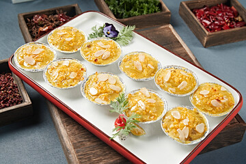 Baked sweet potato mash with almond slices and cheese