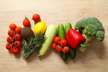 Clean healthy eating habits concept. Fruits, herbs, greens and vegetables mix, colorful juicy organic detox smoothie juice ingredients, wooden background. Vegan vegetarian diet food