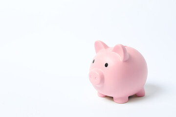 Piggy coin bank on white background for money savings, financial security or personal funds concept.
