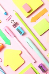 Flat lay with school stationery on pink background, top view