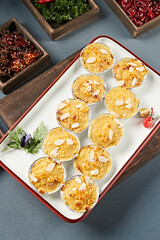 Baked sweet potato mash with almond slices and cheese