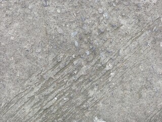 Dirty dark concrete floor texture background, diagonal stripes