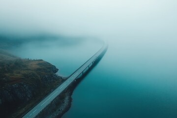 Breathtaking aerial view of bridge spanning a tranquil fjord in Lofoten Islands under foggy conditions, Aerial view Bridge over fjord on Lofoten islands Summer time, foggy hazy day, overcast weather