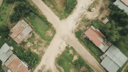 Fototapeta premium Aerial view of rural crossroads, houses, vegetation