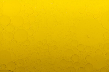 Macro microscope yellow bubble texture, Close-up Yellow bubbles and drops oil background . golden Yellow water bubbles, close up golden oil drop for celebration.