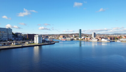 Fototapeta premium Coastal Cityscape with Modern Buildings and Harbor