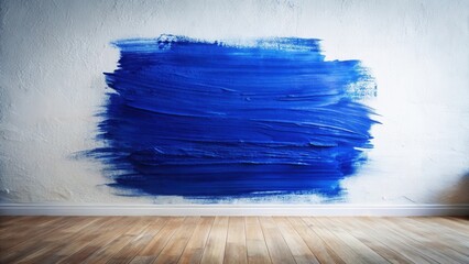 A Large Swatch of Vibrant Blue Paint on a Textured Wall, Showing an Unfinished Room with Wood Flooring