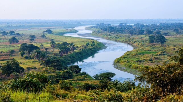 Serene river winding through agricultural landscape