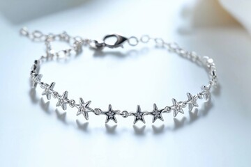Obraz premium Elegant silver bracelet featuring star charms, a beautiful and stylish accessory.