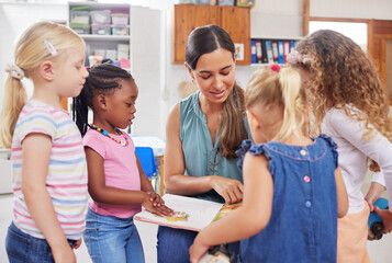 Class, woman teacher and book for lesson, kindergarten education and point to picture. School,...