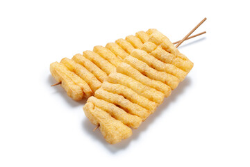 Deep fried tofu with bamboo stick on white background, Chinese traditional snacks