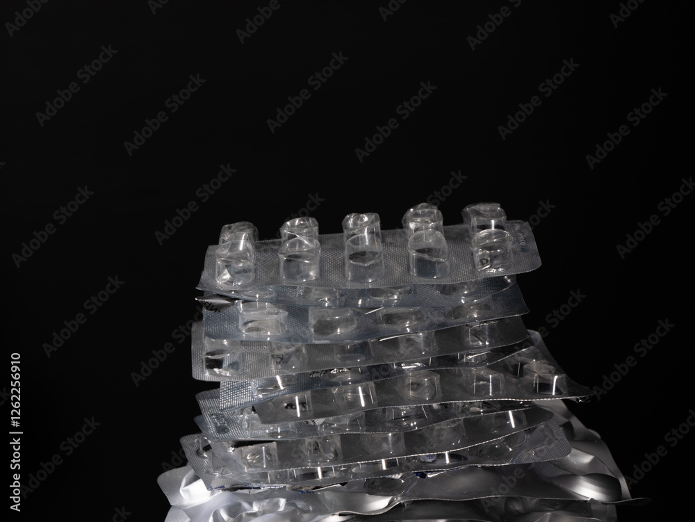 Aufkleber a stack of pills is on top of another stack of pills