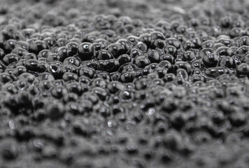 Heap of black caviar texture background. Black caviar pattern