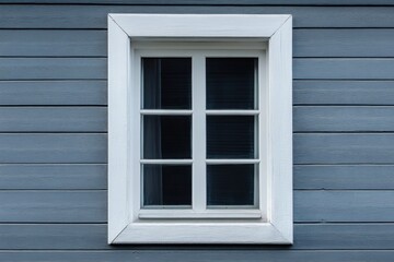 Fototapeta premium A white framed window is set against a gray wall