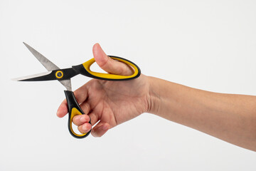Office stationery scissors cutting in hand on white background