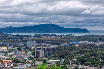 Panoramic nature background of the landscape with views of mountains, sea, trees and fishermen's houses. The beauty of the forest during the seasonal tourism season.