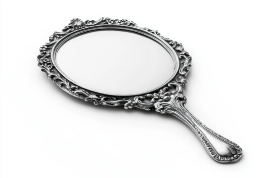Elegant vintage silver hand mirror with ornate floral detailing, reflecting timeless craftsmanship and classic design, perfect for a luxurious vanity setting.