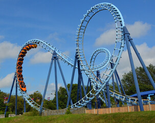 Roller coaster  ride filled  with thrill seekers 