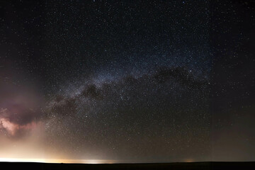 Milky Way Galaxy Shining Above Dark Landscape. Starry Night Sky, Astrophotography, Universe, Space. Celestial Wonder, Night Sky Photography...