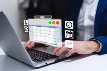 Businessman using laptop in office environment with calendar and icons