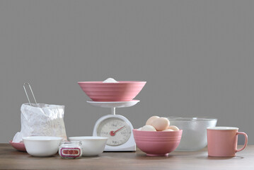 on the table with scales, all the ingredients for preparing the dough for baking