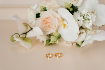 Close up Of Wedding Rings And White Flowers