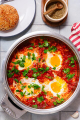Shakshukka with feta and bread.traditional moroccan dish. selective focus. hugge style