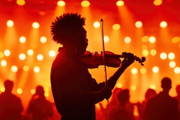 Fototapeta premium Silhouette of violinist plays at concert with audience and lights for entertainment