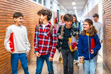 Group of students walking in school hallway after class