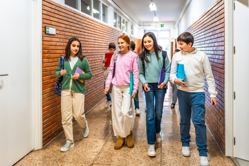 Students walking in school hallway between classes