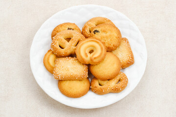 Assorted of danish butter cookies, served on a white plate.
