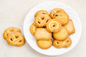 Assorted of danish butter cookies, served on a white plate.
