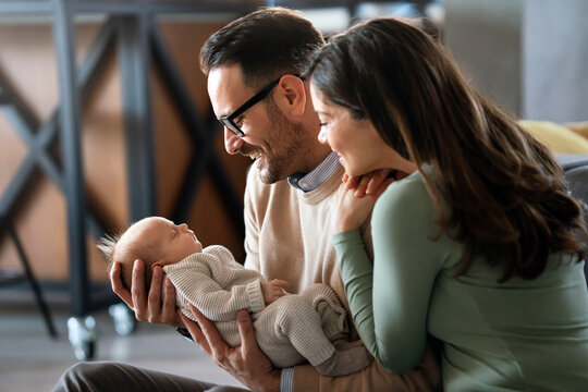 Family love parenthood baby concept. Parents spend happy moments with the newborn child