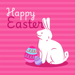 White easter bunny sitting next to decorated eggs on pink background